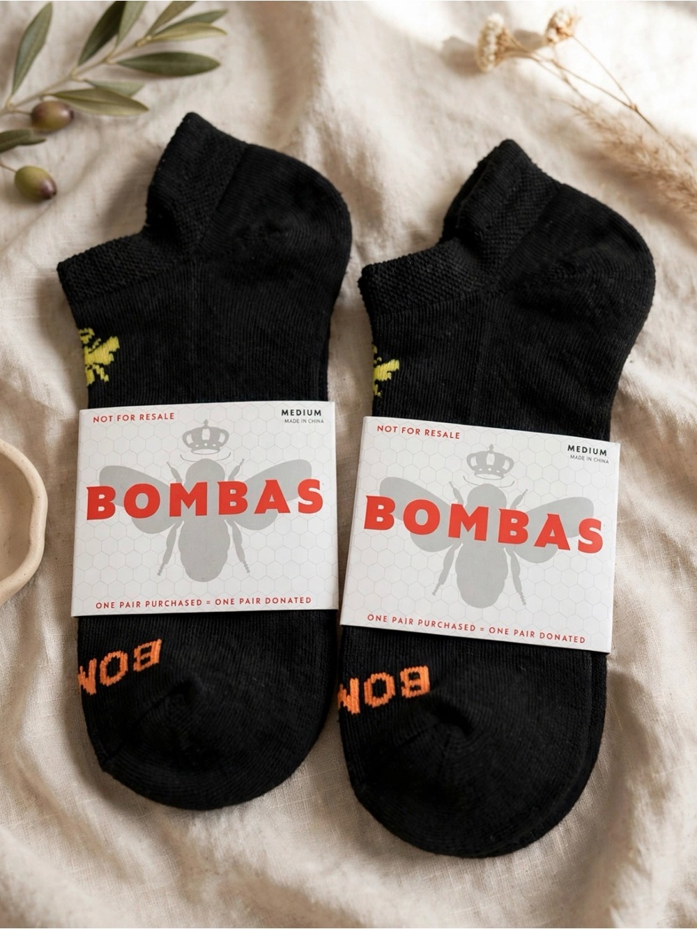 Bombas Black Low-Cut Athletic Socks with Orange Logo Accents